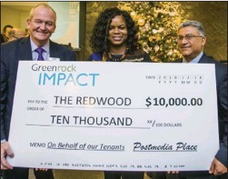 Postmedia Place, present a $10,000 donation cheque to Natasha Hoyte, Child and Youth Counsellor at Redwood Park